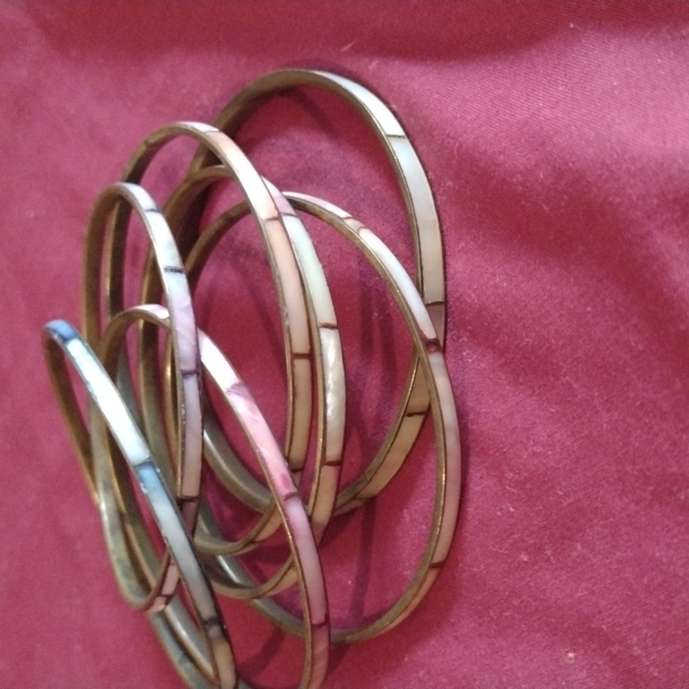 Brass and enamel bangle bracelets. 7total.
